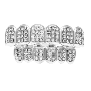 Macro detail of silver hip hop grillz set with pavé cubic zirconia on white background