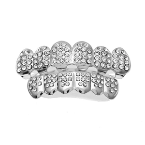 Macro detail of silver iced out hip hop teeth grills with sparkling zircon stones