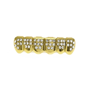 Detailed close-up of single-row six-teeth gold plated hip hop grills with sparkling stones