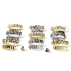 Hip hop gold and silver plated teeth grills with iced out diamonds and letter designs
