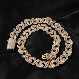Close-up of hip-hop gold chain necklace with X-link design and pavé cubic zirconia