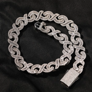 Macro view of iced out infinity link hip hop chain with pave diamonds and buckle detail