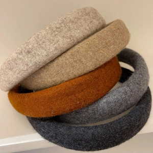 Padded wool felt headbands in beige and grey neutral tones for a high-crowned look