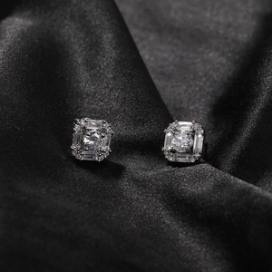 Macro shot of 925 sterling silver octagon stud earrings with AAA cubic zirconia on black silk