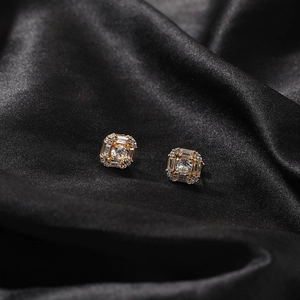 Hip hop style gold geometric square stud earrings with central round diamond and pavé stones