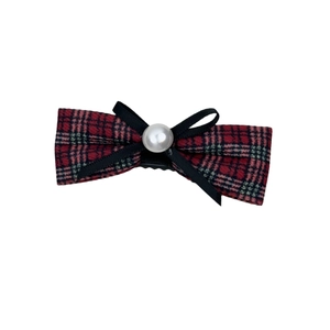 Vintage red and green plaid bow hair clip with pearl detail and elegant black ribbon