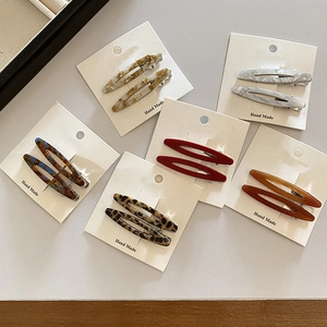 Minimalist acetate willow leaf hair clips in marble and tortoiseshell patterns, set of two