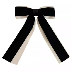 Classic French ballet style velvet bow hair clip with elegant long black and white ribbons