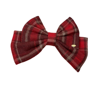 Classic red plaid bow hair clip with vintage golden handmade metal tag on white background