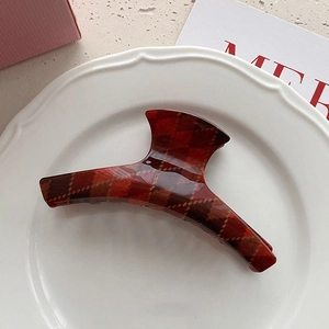 Retro British style red plaid shark hair claw clip in a decorative ceramic plate