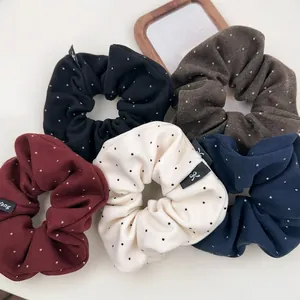 5-piece set of polka dot hair scrunchies in assorted colors for ponytails and buns