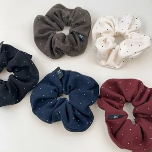 Set of five polka dot knit scrunchies in black, navy, burgundy, coffee, and beige colors