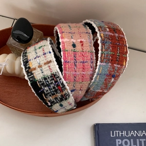Elegant tweed plaid headband with pearl edges shown in a stylish aesthetic lifestyle set