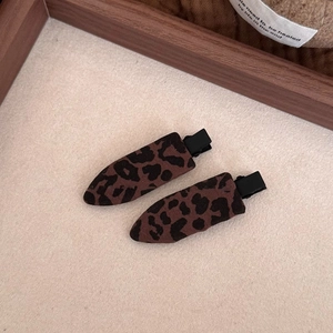 Close-up of leopard print plush hair clips with high-quality metal base for women