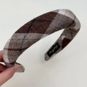 Detail of grey vintage plaid sponge headband showing textured fabric and wide design