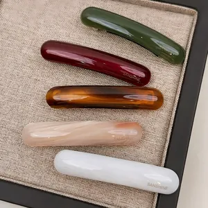 Elegantes Set aus gebogenen Acetat-Haarspangen in fünf Farben inklusive Marmormuster