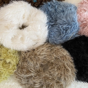 Fuzzy plush oversized scrunchies in various soft autumn colors for hair styling