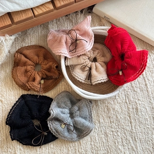 6-pack of knitted bow scrunchies in assorted soft colors for elegant hair styling