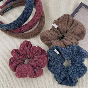 Winter plush headband and scrunchie set in blue, red, and brown wool knit material
