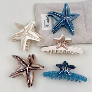Elegant starfish acetate hair claws set in pearl white, blue, and amber colors