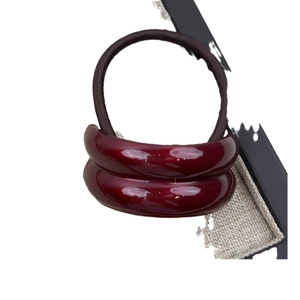 Minimalist burgundy resin geometric curved hair tie with high-elastic dark brown band