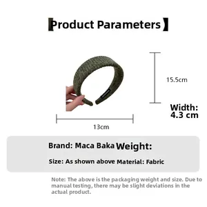 Detail showing dimensions of the dark green knitted wide headband made of fabric