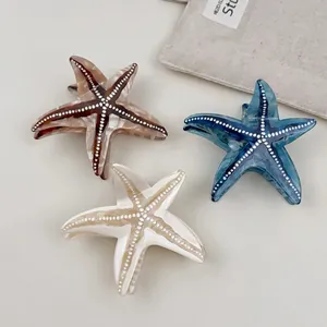 Elegant ocean starfish acetate hair claws with marble patterns and white dot accents