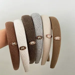 Retro bow headbands in khaki and brown tones with elegant knitted fabric texture