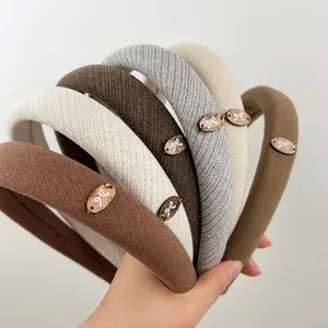 Retro thickened sponge headbands with bow metal tag in various earthy colors