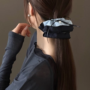 Elegant sea salt blue patchwork hair scrunchie with black bow and pearl detail for women
