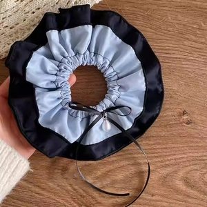 Chic blue denim and black scrunchie with a silk bow and elegant pearl pendant accessory