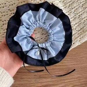 Blue and black satin scrunchie with a ribbon bow and elegant white pearl pendant