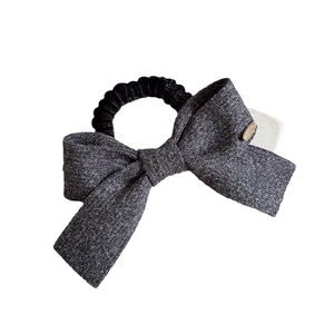 Elegant dark grey bow hair tie with high elastic band and gold metal hardware