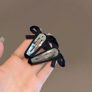 Elegant set of two black velvet hollow bow hair clips with silver metal snap clips