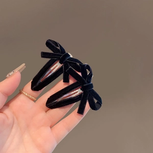 Pair of elegant black velvet bow hair clips with classic water drop BB clip design