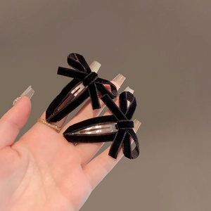 Set of two elegant black velvet bow hair clips with minimalist metal BB clip design
