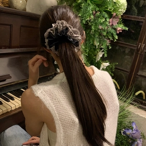 Elegant velvet lace scrunchie for women shown on a model low ponytail hairstyle