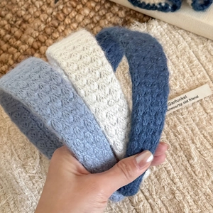 Knitted diamond pattern headbands in blue and cream with soft mohair texture