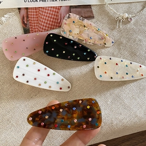 Set of colorful crystal hair clips in floral and solid colors for elegant side styling