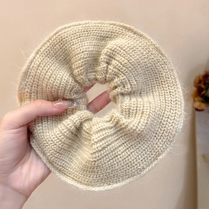 Oversized knit scrunchie in beige mohair wool for elegant ponytail styling