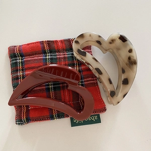 Retro heart-shaped hair claw clips set in burgundy and leopard print acetate finish