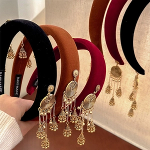 Vintage velvet headband with golden bell tassels and handmade craftsmanship