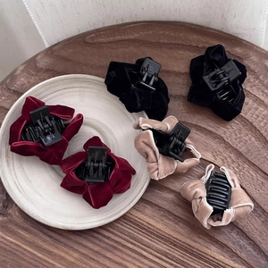 Elegant velvet bow hair claw clips in red, black and gold colors for women's hairstyling