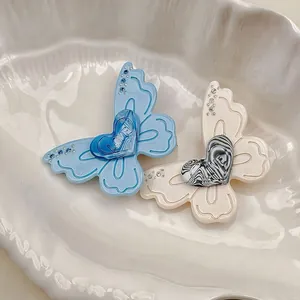Barrettes papillon exquises avec cœur LOVE et strass dans les couleurs bleu et blanc