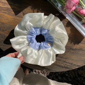 Blue plaid and cream satin oversized scrunchie for hair styling with a soft silk texture