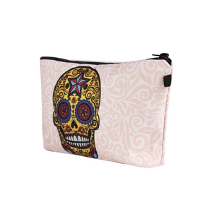 Detail view of durable canvas makeup bag with colorful Mexican sugar skull floral print