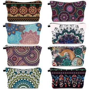 Flat lay collection of printed cosmetic bags with mandala and paisley patterns