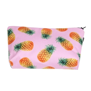 Close-up of pink pineapple print makeup bag showing durable fabric and zipper closure