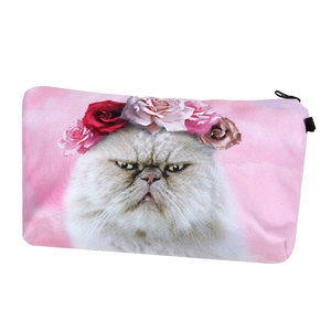 Detail of a pink makeup bag featuring a cute cat with a flower crown and black zipper