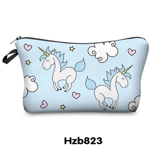Detail of light blue unicorn makeup bag with stars and hearts digital print